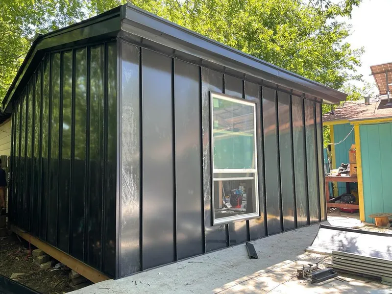Black standing seam metal wall panels for Metal Roof Installation in Pueblo West